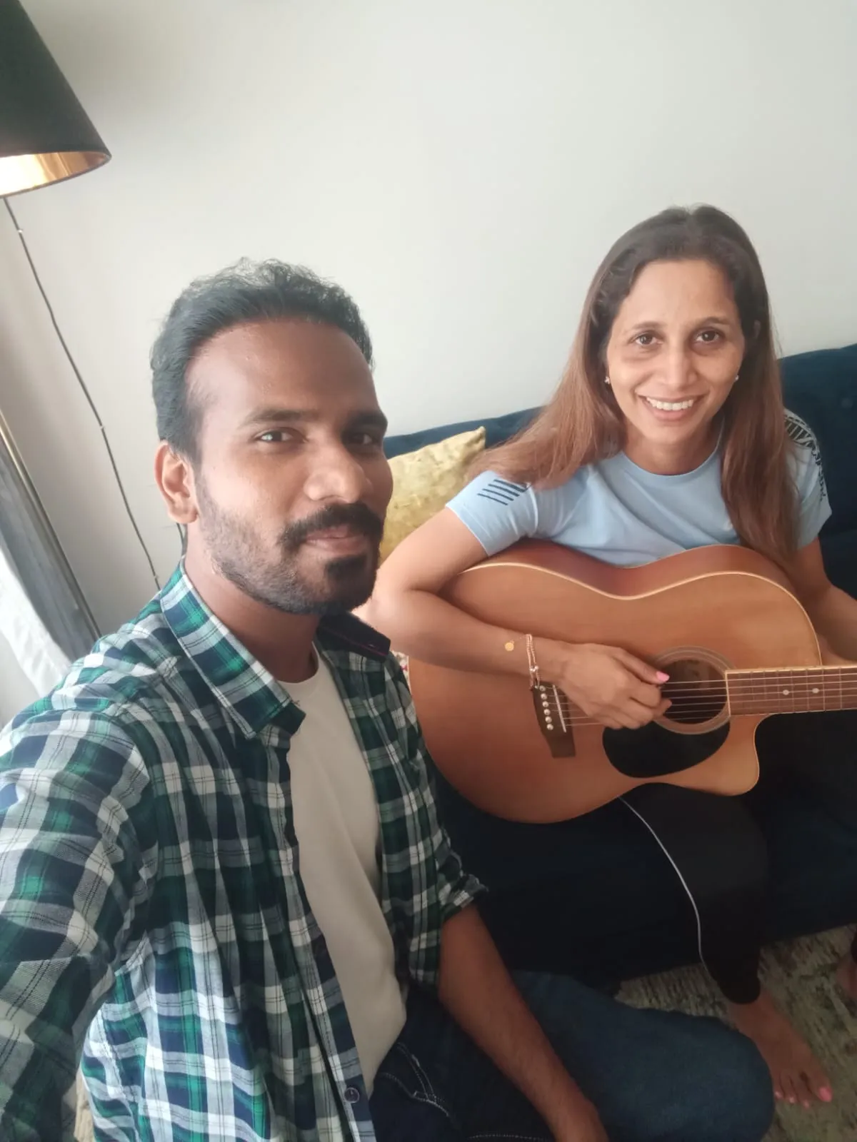 An adult learner during a guitar lesson